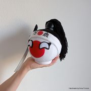 Small Japanball Banzai with a katana, eyelashes, and a girl’s hairstyle